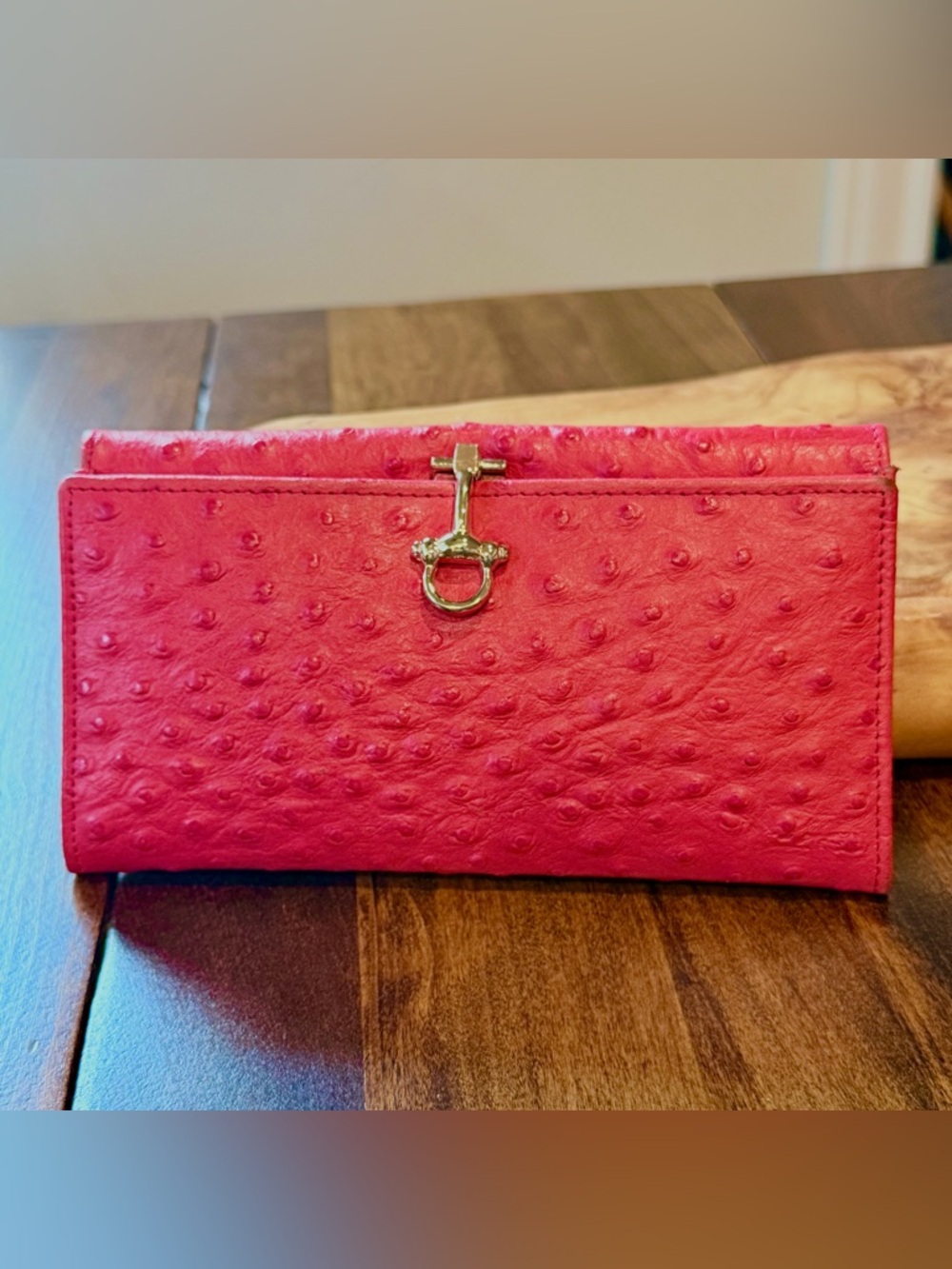 Vera Pelle Wallet crafted from genuine ostrich leather. Red with Gold tone clasp